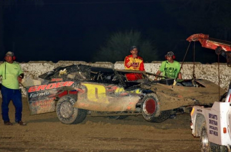 Rich Pratt and his wrecked No. 0. (R.E. Wing)