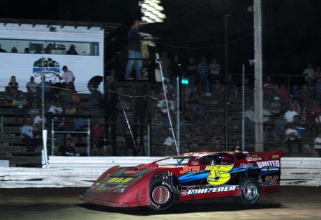 Mark Whitener takes the checkers at North Florida. (Rick Warren)