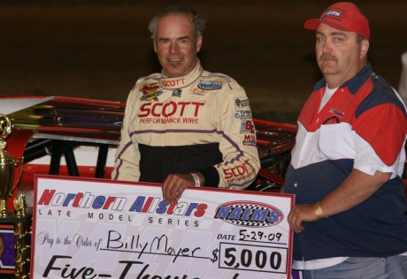 Billy Moyer picks up his winnings at PIR. (kohlsracingphotos.com)