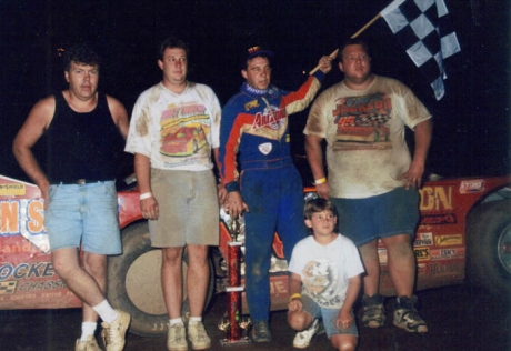 Josh Richards (kneeling) in victory lane with Steve Francis years ago.