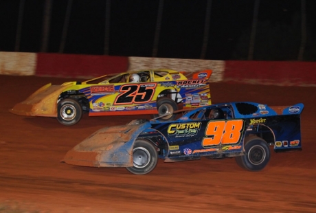 Winner Casey Barrow (98) battles with Shane Clanton (25). (Gary Laster)