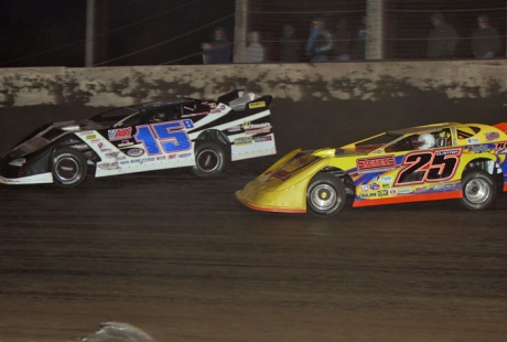 Shane Clanton (25) stalks Brian Birkhofer (15B) at Farmer City. (Jim DenHamer)