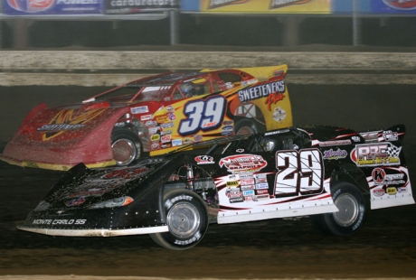 Darrell Lanigan (29) slides under Tim McCreadie (39). (Todd Battin)