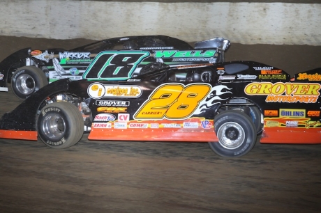 Eddie Carrier Jr. (28) works on Eric Wells (18) at Florence. (Jeremey Rhoades)