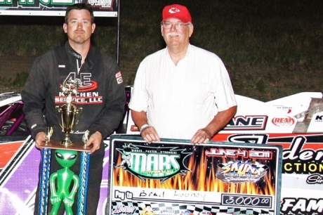 Brad Looney (left) visits victory lane at Salina Highbanks Speedway. (Ron Mitchell)