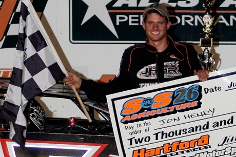 Jon Henry picks up his sixth career checkered flag with ALMS. (Jim DenHamer)