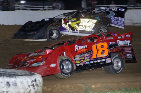 Shannon Babb (18) rolls under Jeep Van Wormer (55). (Jeremey Rhoades)