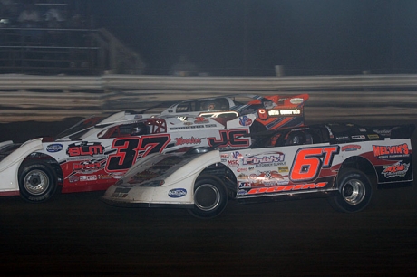 Jared Hawkins (37) grabs the lead after a three-wide battle. (Todd Battin)