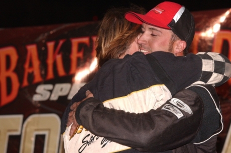 Brad Pounds gets a hug from his father Scott. (K.C. Rooney)