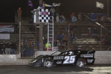 Steve Lance Jr. takes the checkers at Tri-City. (stlracingphotos.com)