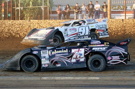 Jeremy Payne (74) races under Steve Francis at Bunbury Speedway. (Jody Shanhun)