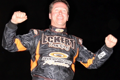 Rick Eckert celebrates atop his car. (Photos by Crawford)