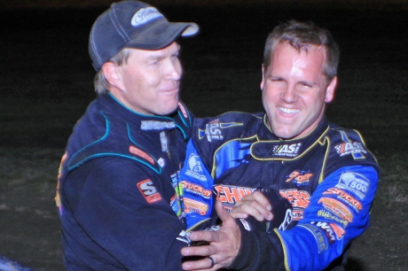 Runner-up and teammate Chris Wall (left) congratulates winner B.J. Robinson. (Best Photography)