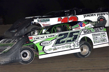 Kevin Weaver (12) and Jason Feger (25) battle for the lead at Kankakee. (Jim DenHamer)