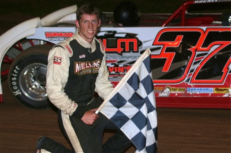 Jared Hawkins celebrates his $3,000 victory. (Todd Battin)