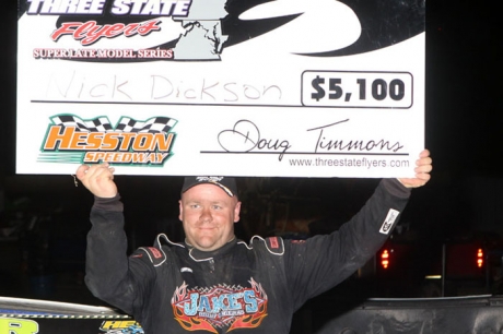 Nick Dickson shows off his earnings Sunday at Hesston (Pa.) Speedway. (pbase.com/cyberslash)