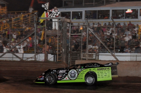 Scott Bloomquist takes the checkers for his $30,000 payday. (Jason Shank)