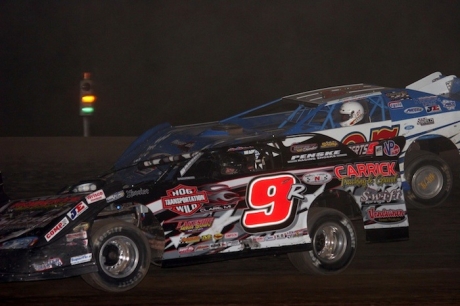 Curtis Roberts (9) uses contact to make a race-winning pass that was disqualified. (Steve Datema)