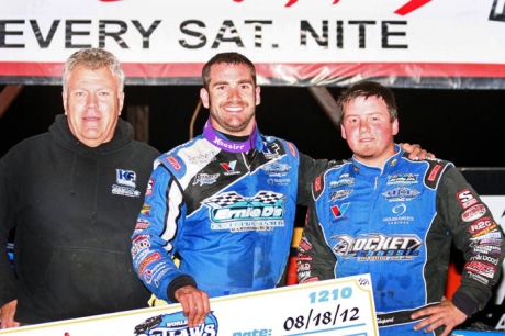 Josh Richards (center) embraces runner-up and teammate Brandon Sheppard in victory lane. (Steve Datema)