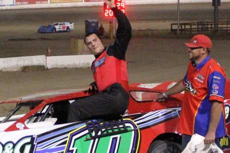 John Hansen emerges after his victory at Aztec Speedway. (www.facebook.com/Crimson.n.cream.photo)