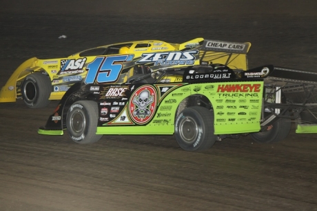 Brian Birkhofer (15B) fends off Scott Bloomquist. (Jeremey Rhoades)