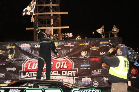 Jimmy Owens climbs atop his car celebrating his $50,000 victory. (rdwphotos.smugmug.com)