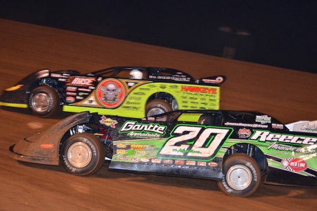 Jimmy Owens (20) and Scott Bloomquist (0) battle at East Alabama. (Eric Gano)