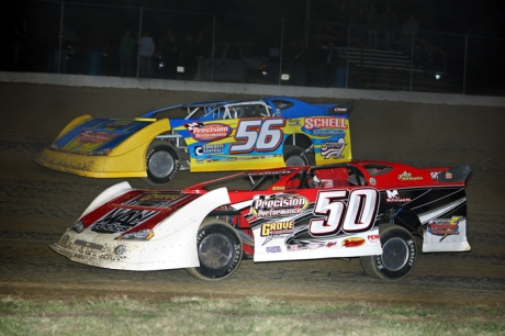 Denny Eckrich (50) slips past his younger brother Andy (56) to take command at 34 Raceway. (John Vass)