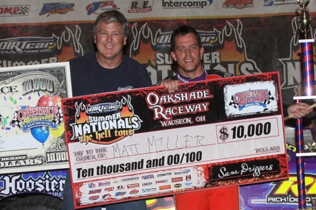 Matt Miller celebrates his $10,000 victory with car owner Rick Delong. (Jim DenHamer)