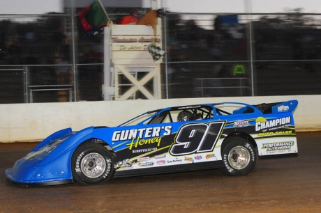 J.T. Spence takes the checkers in the Winchester 200 finale. (Travis Trussell)