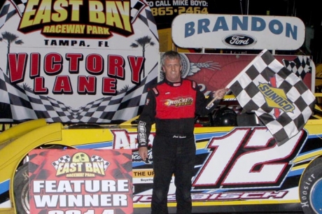 Jack Nosbisch Jr. picks up the checkered flag. (Mike Horne)