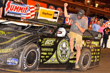 A crew member celebrates Scott Bloomquist's trip to victory lane. (thesportswire.net)