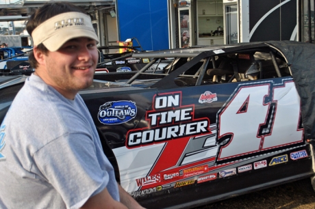 Brandon Overton in front of the Rattliff Racing car. (DirtonDirt.com)