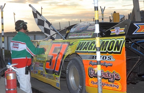 Joel Cryderman receives the checkered flag. (http://www.motorsports-addiction.com)