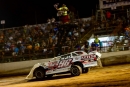 Feature winner Tanner English takes the checkers July 1 at Farmington (Mo.) Empire Speedway on the DIRTcar Summer Nationals. (highsideraceshots.com)