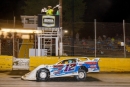 Ashton Winger takes the checkers for July 21's Schaeffer's Southern Nationals victory at Senoia (Ga.) Raceway. (praterphoto.com)