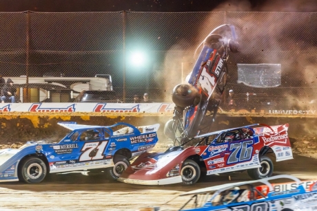 Trey Mills heads over the turn-two wall. (heathlawsonphotos.com)