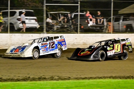 Ashton Winger (12) battles with Jake O'Neil (0). (Zack Washington)