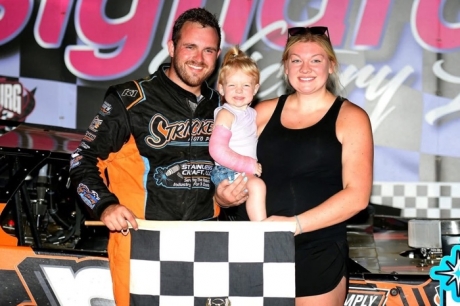 Adam Stricker with his family in victory lane. (Steve Alcorn)