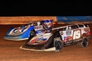 Ryan Gustin (19) and Benji Hicks (55) battle for the May 26 lead at Fayetteville (N.C.) Motor Speedway. Gustin won the $10,000 Mid-East Super Late Model Series event. (ZSK Photography)
