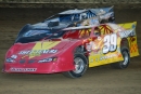 Tim McCreadie (39) of Watertown, N.Y., overcame a late-race surge from Scott Bloomquist to score a $10,000 World of Outlaws Series victory at Hartford, Ohio&#039;s Sharon Speedway for his third straight tour triumph. (Paul Oyler)