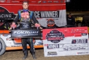 Ricky Thornton Jr. poses with his Peach State Classic winner&#039;s trophy after capturing Nov. 16&#039;s 75-lap Castrol FloRacing Night in America weekend finale at Senoia (Ga.) Raceway. (praterphoto.com)