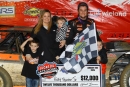 Ricky Thornton Jr. and a family portrait Jan. 31 at All-Tech Raceway in Ellisville, Fla., after his second straight Lucas Oil Late Model Dirt Series victory. (mikerueferphotos.photoreflect.com)