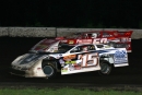 Justin Fegers (F15) of Mound, Minn., took control when Denny Eckrich (50) lost a rear end with 15 laps remaining and won the World Dirt Racing League&#039;s PolyDome Late Model Series stop at Hamilton County Speedway. (Mike Ruefer)