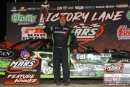 Jason Feger celebrates his $5,000 victory in Sept. 12&#039;s opener of the MARS-sanctioned Corn State Nationals at Davenport (Iowa) Speedway. (mikerueferphotos.photoreflect.com)