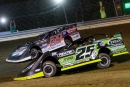 Winner Jason Feger (25) and Ryan Unzicker (24) battle for the lead June 12 at Coles County Speedway's first DIRTcar Summer Nationals feature. (highsideraceshots.com)