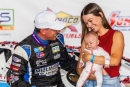 Devin Moran with wife Lakia and daughter Poppy in June 27's victory lane at Lernerville Speedway in Sarver, Pa., for his $50,000 Firecracker 100 victory on the Lucas Oil Series. (heathlawsonphotos.com)