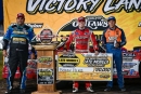 Bobby Pierce holds the World of Outlaws Late Model Series winner's check for the sixth straight race June 30 at Norman County Raceway in Ada, Minn. (Emily Schwanke/woolms.com)