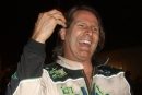 Scott Bloomquist brushes back his hair in victory lane after Nov. 9, 2003&#039;s victory for his eighth National 100 victory at East Alabama Motor Speedway. (DirtonDirt.com)